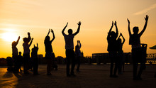 Unrecognizable People Silhouette Dancing On City Festival At Sunset. Street Dance, Holiday, Summer And Urban Culture Concept