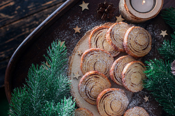 Wall Mural - Christmas beautiful shortbread cookie in the shape of a saw cut tree with cocoa rings on a wooden table, horizontal, copy space