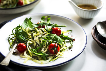 Wall Mural - Zucchini noodle with Cherry tomato and Pumpkin seed salad