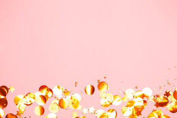 Wall Mural - Pink confetti and stars and sparkles on pink background.