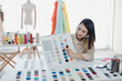 © P Stock - Designer are thinking and designing clothes for customers order items.