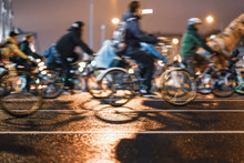 Silhouettes Of Group Colorful Cyclists On City Road, Illumination, Abstract, Motion Blur, Bike Festival. Concept Of Modern Lifestyle, Healthy Lifestyle, For Background