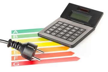 Wall Mural - european energy classification labels with power cord, plug and calculator on white - energy saving 