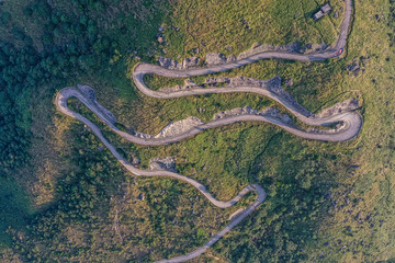 Wall Mural - Aerial view of asphalt road in mountain