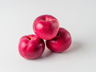 Organic red apple isolated on white background.