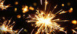 sparkler on black background, burning sparkler firework. Happy new year and Merry christmas concept. Happy holidays. Abstract blurred of Sparklers for celebration. Magic light. Winter Xmas decoration.