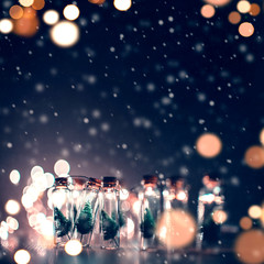 Wall Mural - close-up, elegant christmas tree in glass jar with snowflakes background. copy space.