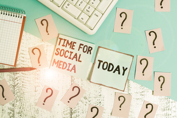 Conceptual hand writing showing Time For Social Media. Concept meaning meeting new friends discussing topics news and movies Writing tools and scribbled paper on top of the wooden table