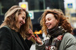 © Evgeny Lobanov - Two girls chatting on the street of the Moscow city happy and laughing