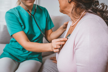 Wall Mural - Doctor is using a stethoscope for patients patient examination. To hear the heart rate, For patients with heart disease. -