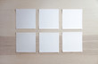 6 blank empty white sticky notes on clean wood background, from top view with copy space