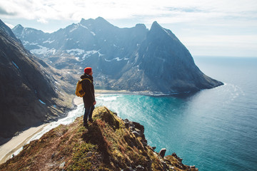 man stand on cliff edge alone enjoying aerial view backpacking lifestyle travel adventure outdoor va