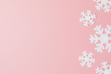 Winter Pattern Made Of Snowflakes And On Pink Background. Christmas Concept. Flat Lay. Copy Space For Your Text