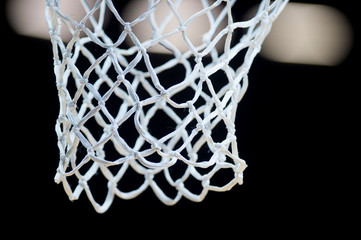 Wall Mural - Empty Swooshing Basketball Net Close Up with Dark Background