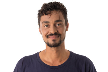 mixed race man looking happily in camera. Standing against white background.