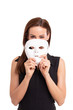 © sakkmesterke - Young woman taking off mask from face isolated