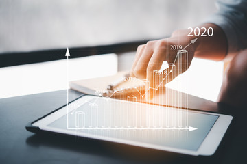 business analytics and financial technology concept, virtual screen chart from the screen of digital tablet computer.