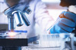 © Looker_Studio - Scientist with equipment and science experiments ,laboratory glassware containing chemical liquid for design or decorate your content,microscopoe .Pipette dropping a sample into a test tube