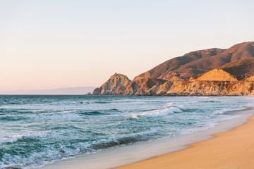 view north along california highway one at montara beach with pacific ocean in golden hour sunset li