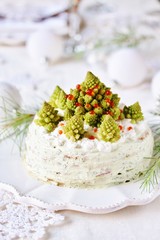 Wall Mural - crep cake for Christmas and New Year.  Christmas tree decorations cabbage romanesco. Snack cake with salmon, avocado and soft cheese. Grains of cottage cheese play the role of snowdrifts.