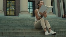 Student Read Book At Stairs Of Harvard University's Building, One Of The Ivy League, University Life, Living At Cambridge, Discussing Difficult Topics