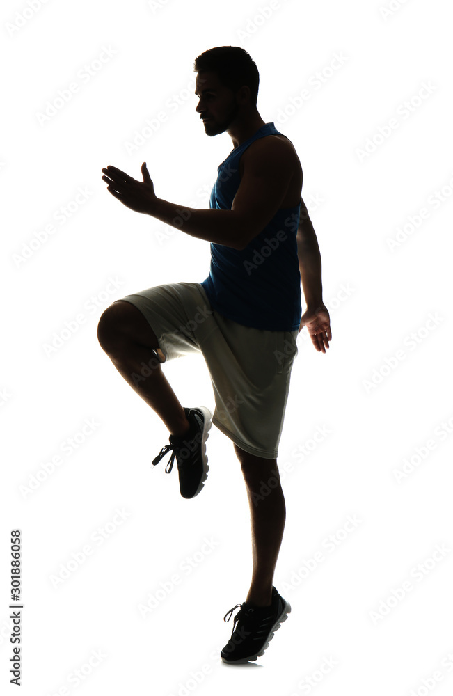 Silhouette of sporty young man on white background