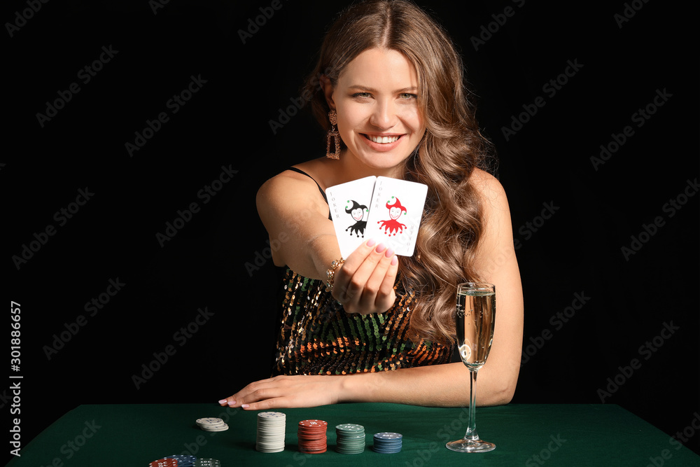 Female poker player at table in casino