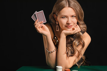 Female poker player at table in casino