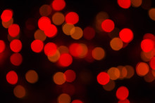 Abstract Blurry Background Bokeh. Red Glitter Vintage Lights Blurred Background. Defocused, Soft Focus.