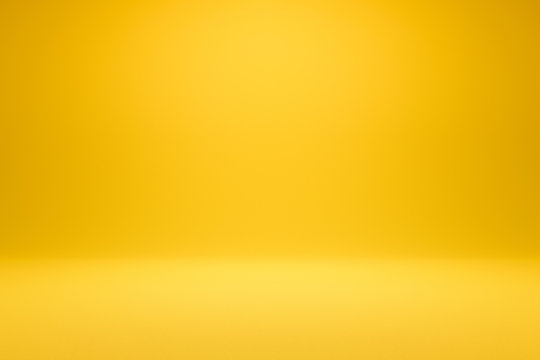 empty yellow background and spotlight with studio for showing or design. blank backdrop made from ce
