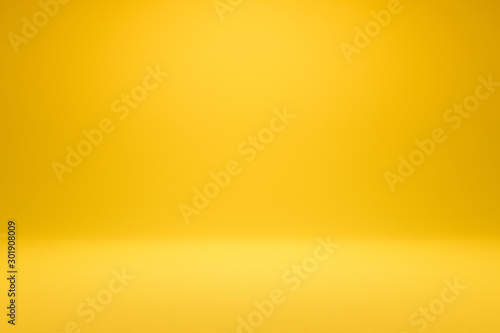 Cuadros en Lienzo Empty yellow background and spotlight with studio for showing or design