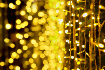 Wall Mural - Blurred and bokeh of Christmas lights and refection lighting on black background.