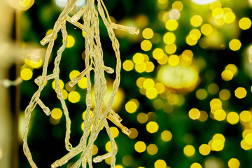 Wall Mural - Christmas lights on blurry and bokeh of Christmas lighting  background.