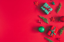 Christmas Composition. Gift Box, Christmas Decorations On Red Background. Flat Lay, Top View, Copy Space