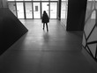 woman leaving the hall of a building