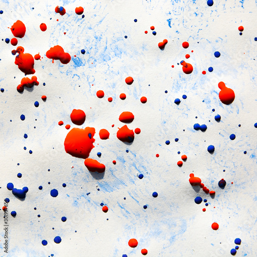 Abstract strokes of watercolor blue paint with red splashes for background