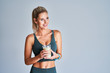 © Kalim - Adult woman drinking healthy smoothie after workout