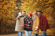 © Pixel-Shot - Friends taking selfie in autumn park