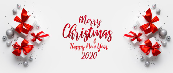 christmas and new year holiday background. xmas greeting card. christmas red ribbon gifts and orname
