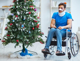 Wall Mural - Injured disabled man celebrating christmas at home