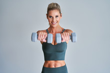 Adult Woman Working Out With Dumbells