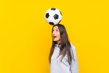 Young Football Player Woman Over Isolated Yellow Background