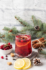 Wall Mural - Cranberry juice with lemon and cane sugar. Winter hot drink.