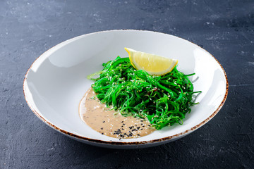 Wall Mural - Japanese Cuisine - Chuka Seaweed Salad. Served with Nuts Sauce and Sesame