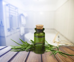 Wall Mural - Pile of lavender flowers and a dropper bottle with lavender essence