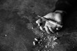 Addict man dead after inject drug overdose with syringe injection heroin to hand. narcotic addiction concept, International Day Against Drug Abuse. black and white picture