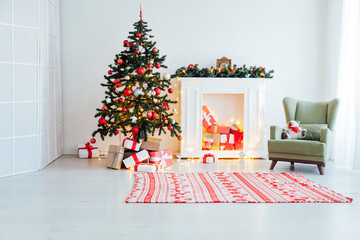 Wall Mural - Christmas tree with gifts in the interior of the white room decor for the new year