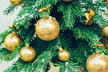 Wall Mural - Green fir tree with golden balls. Christmas wallpaper.