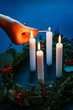 Woman lighting the candles of a Christmas Wreath 