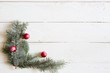 © Alik Mulikov - Christmas background fir tree and christmas decorations on wooden table with copy space. Top view